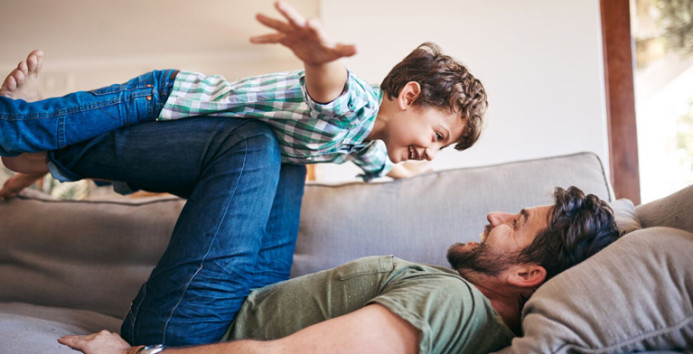 adult playing with child 767x418