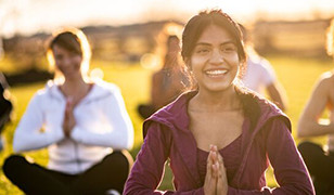 women practise yoga