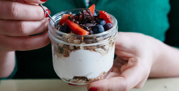 woman eating yoghurt